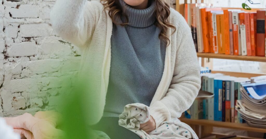 Annoyed woman emotionally shouting at husband and proving opinion to partner while man browsing laptop and ignoring